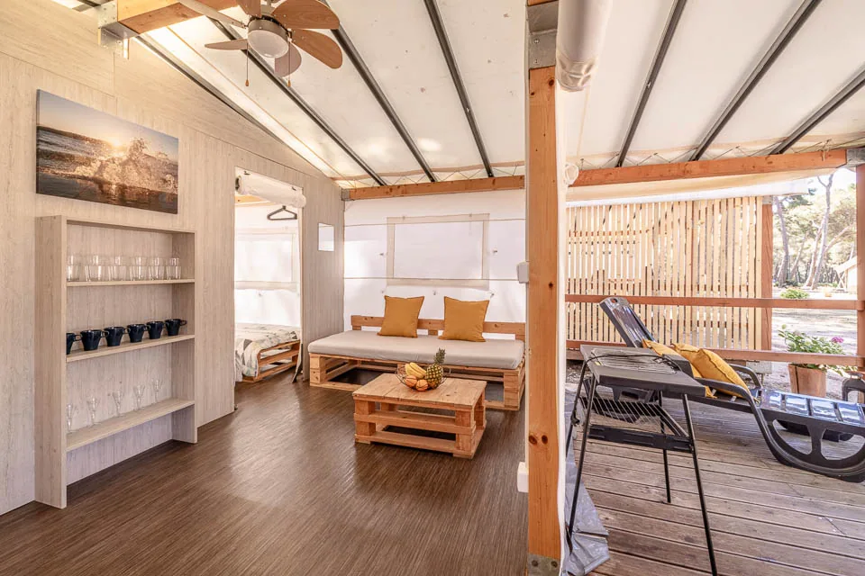 Living area and covered terrace of a Glamping PLUS safari tent at Camp Čikat